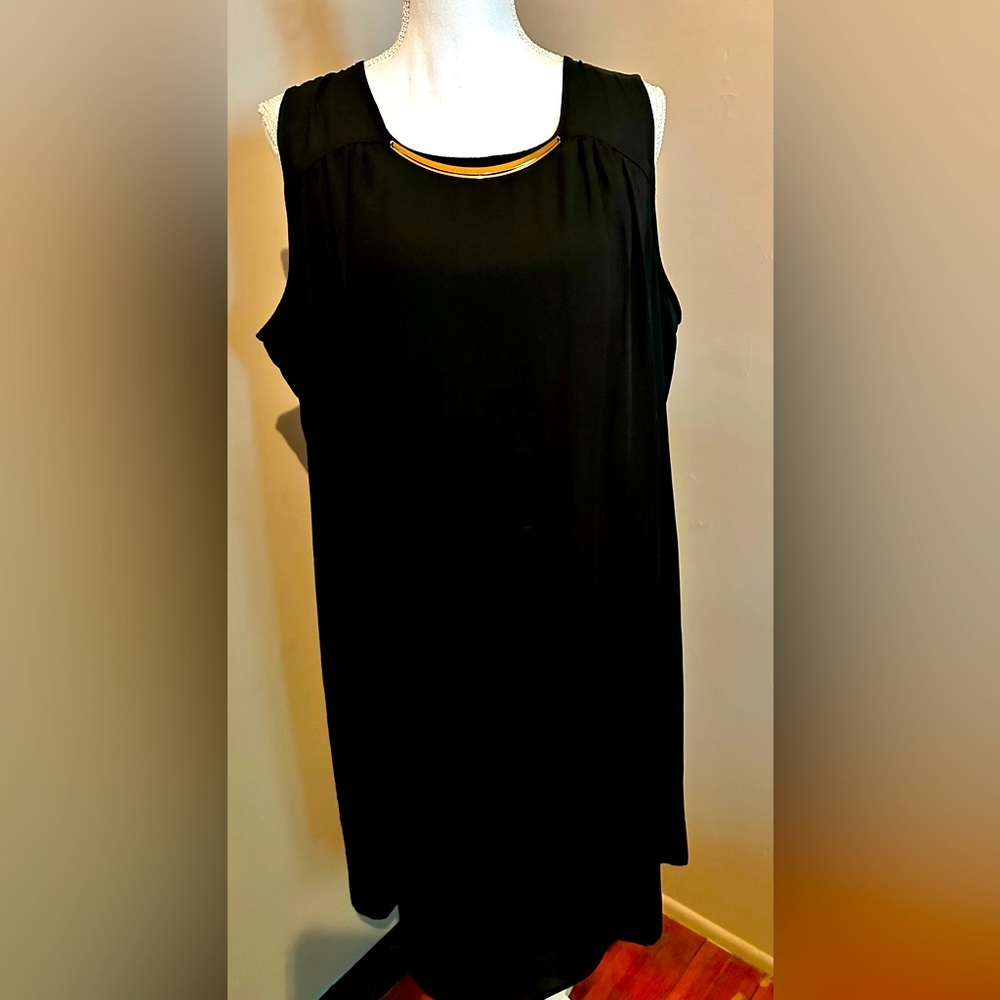 Black sleeveless number, with a gold neckline accent piece, lightweight fabric!